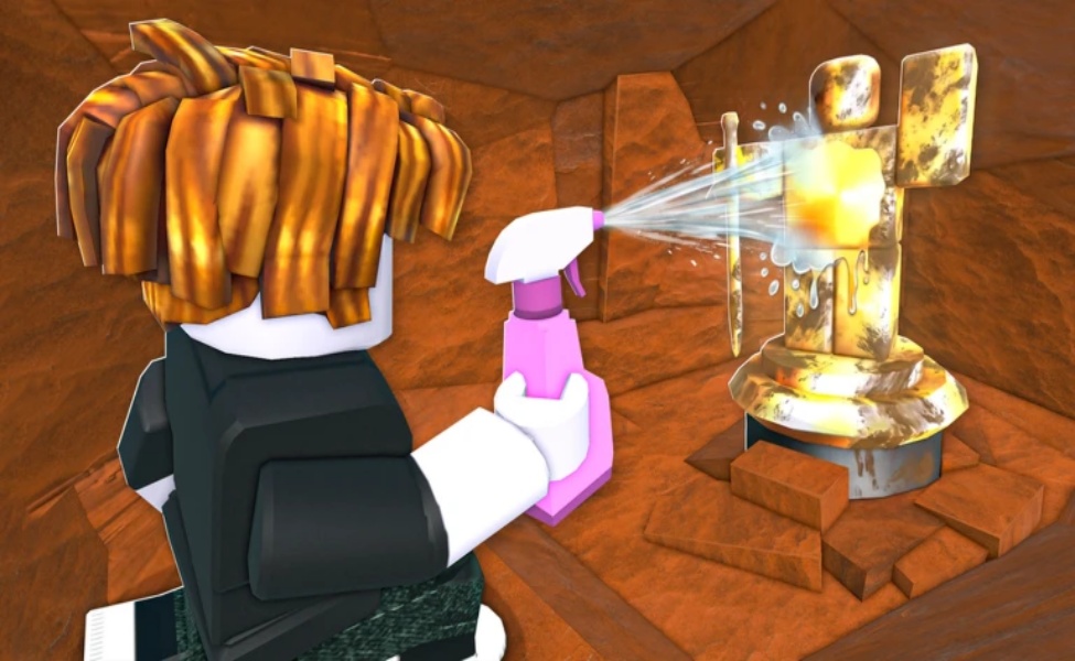 Player spraying cleaning solution on golden statue in Roblox Dig and Clean game