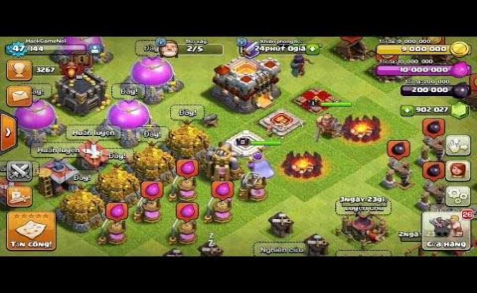 Clash of Clans game interface showing village layout with defensive structures