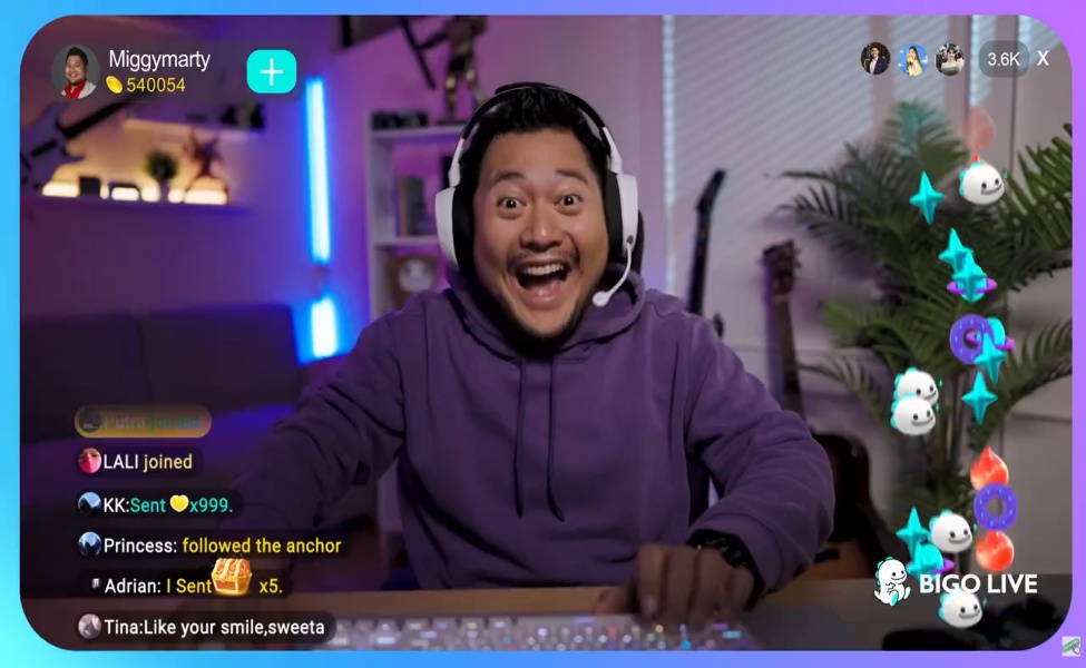 Streamer smiling while wearing headphones during a BIGO LIVE broadcast