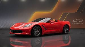 Red Chevrolet Corvette C7 convertible sports car displayed in studio setting