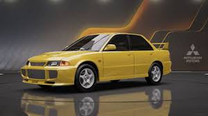 Yellow Mitsubishi Lancer Evolution III GSR racing car on display