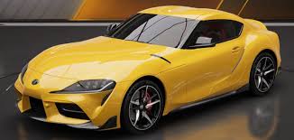 Yellow Toyota GR Supra sports car displayed against dark background