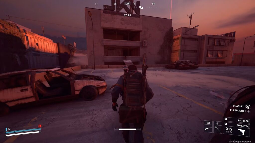 Player character standing in Buried City with abandoned vehicles and industrial buildings at dusk