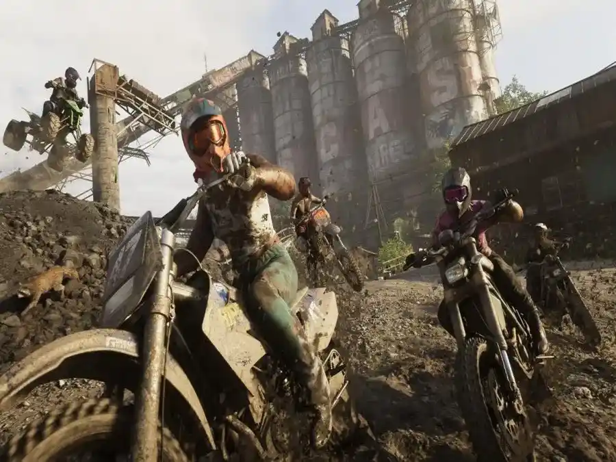 GTA 6 gameplay showing character on dirt bike in industrial urban setting
