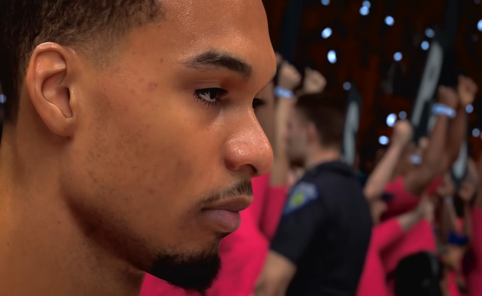 Close-up profile of male player in pink and black basketball uniform at crowded arena event