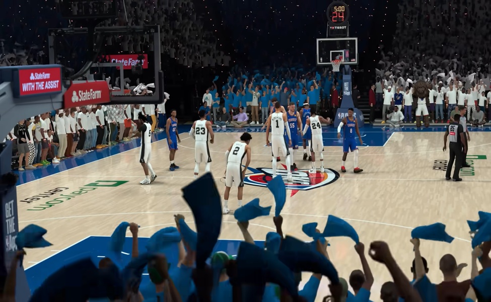 NBA 2K27 gameplay showing basketball match between blue and white teams in arena with crowd