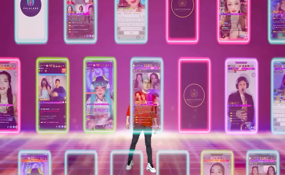 Person standing before neon-lit mobile phone displays showing live streaming interface