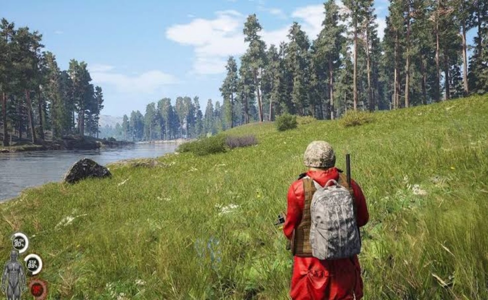 Survivor in red jacket hiking through grassy meadow beside river with forest backdrop