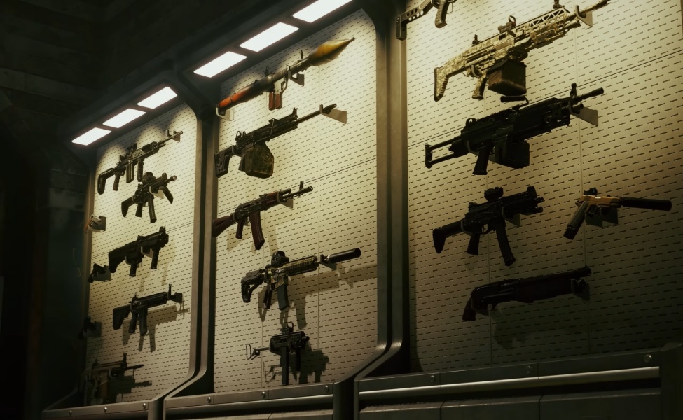 Display of various assault rifles and tactical weapons mounted on pegboard wall panels