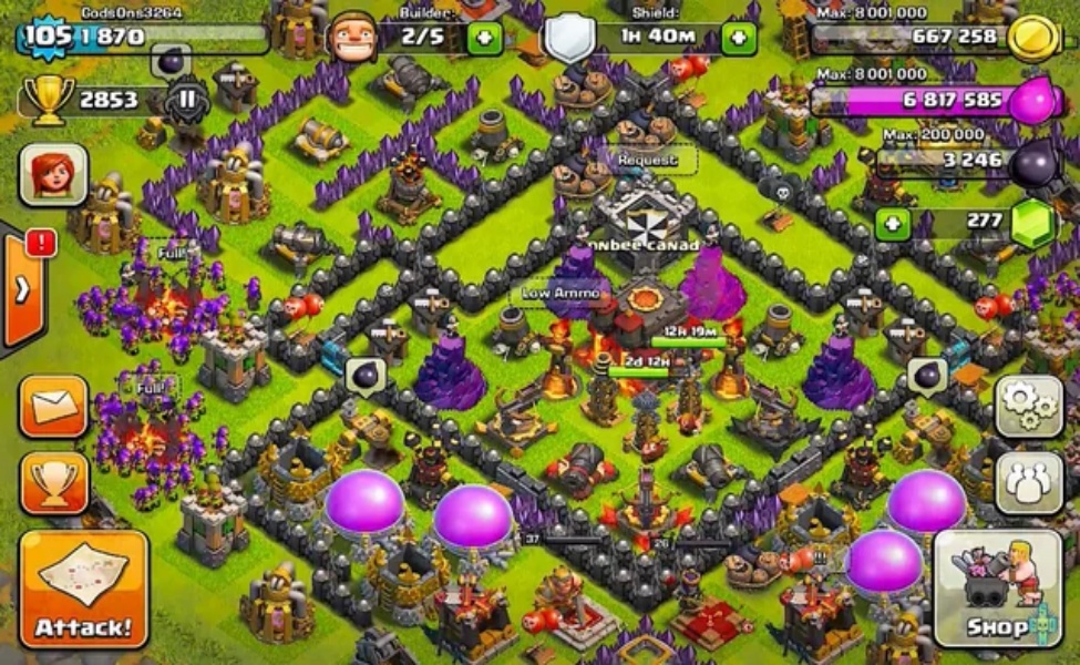 Clash of Clans base layout with purple decorations and resource storage buildings visible on map